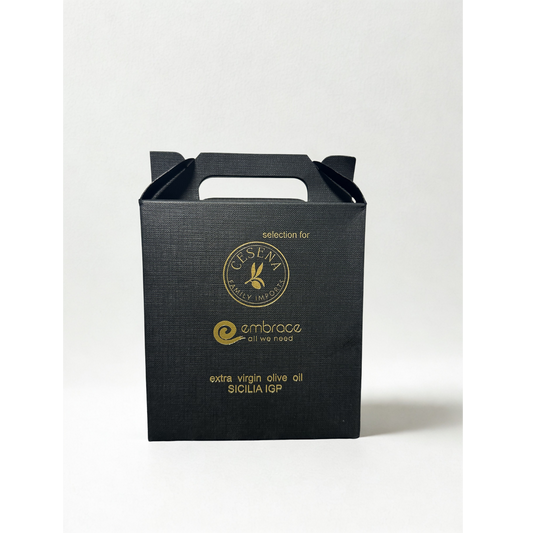 Black olive oil packaging box with gold text and branding on a white background